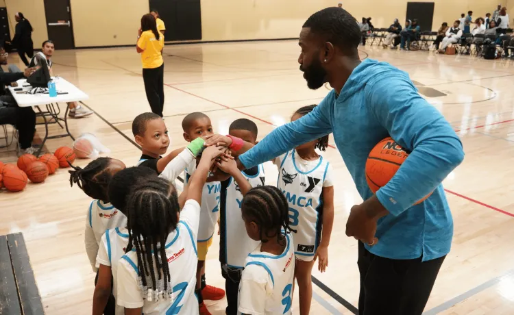 Youth Basketball 2025 - kids huddled in a circle