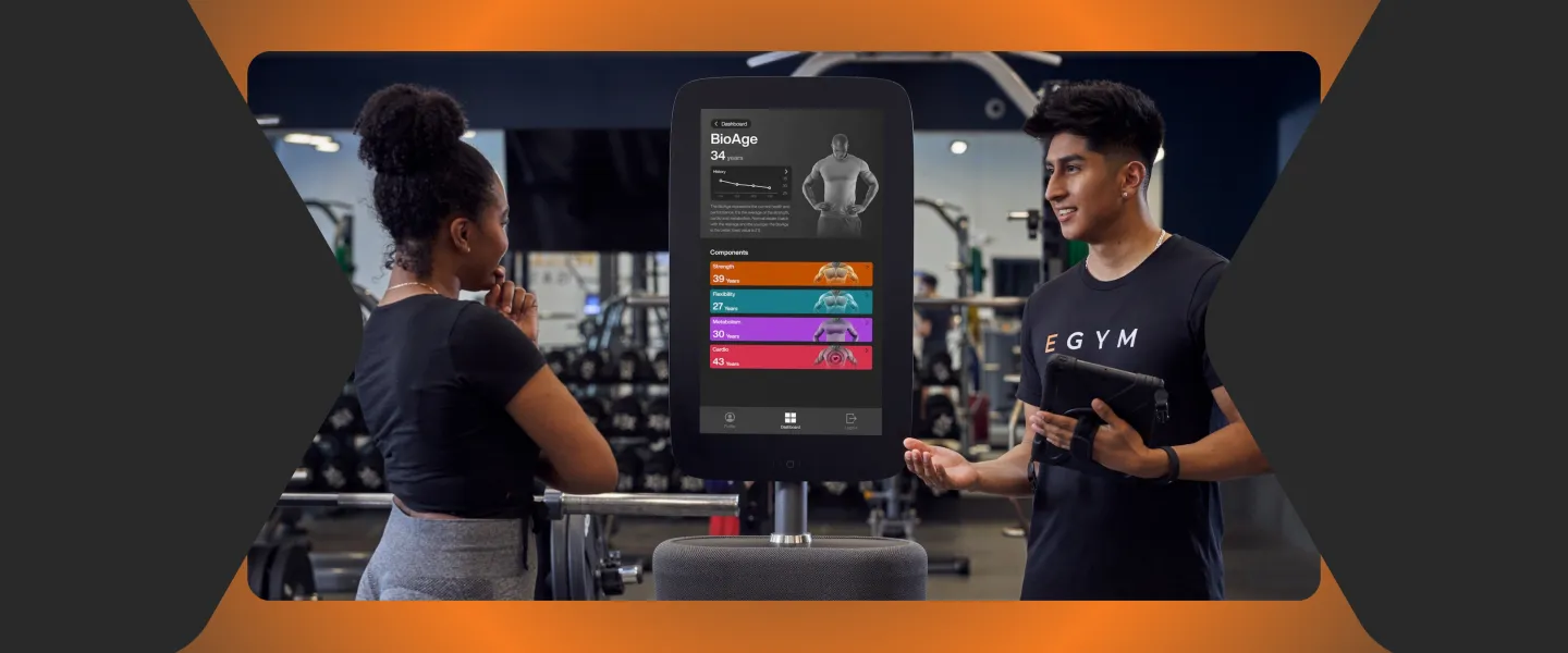 EGYM trainer with visitor/member in the gym