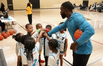 Youth Basketball 2025 - kids huddled in a circle